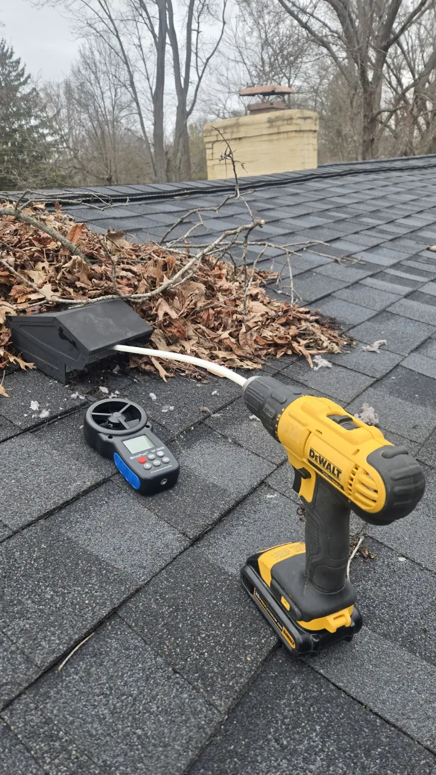 Airflow testing equipment used during a rooftop dryer vent cleaning visit